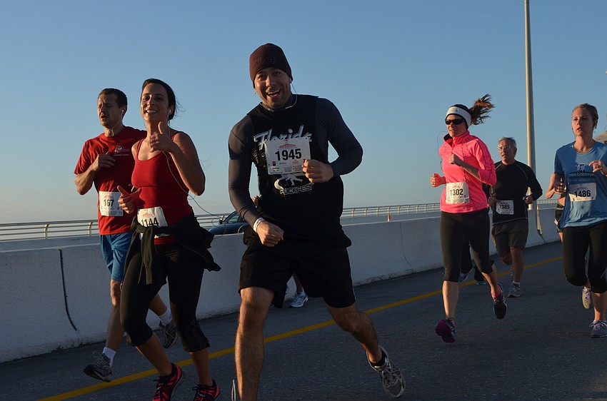 Cameron Bahan, Michelle Jordan, Paul De Santis, Blake Lyon, Dennis Mitrano and Jaynie Peterson run down Ringling Bridge.