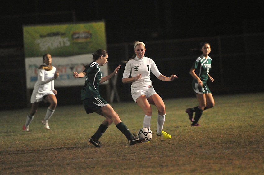 Lakewood Ranch midfielder Talia Falco looks to keep a Venice player from passing the ball.