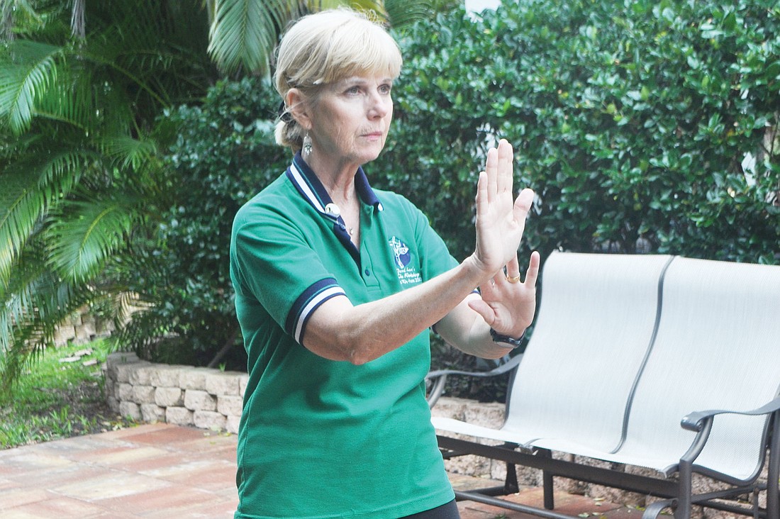 Christine Killeen primarily teaches the Sun-style of tai chi, in which one foot advances to the ground before the other one follows.