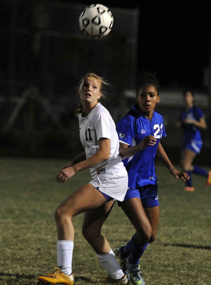 Lakewood Ranch defender Tatum Young attempts to between the ball and an Ida Baker opponent.