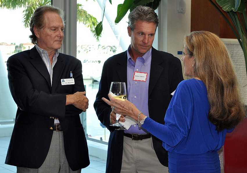 Dr. Jim Whitman and Randall Langley chat with Lynn Larson Wednesday, Sept. 19 at Longboat Key Republican Clubâ€™s meeting at the Sarasota Yacht Club.