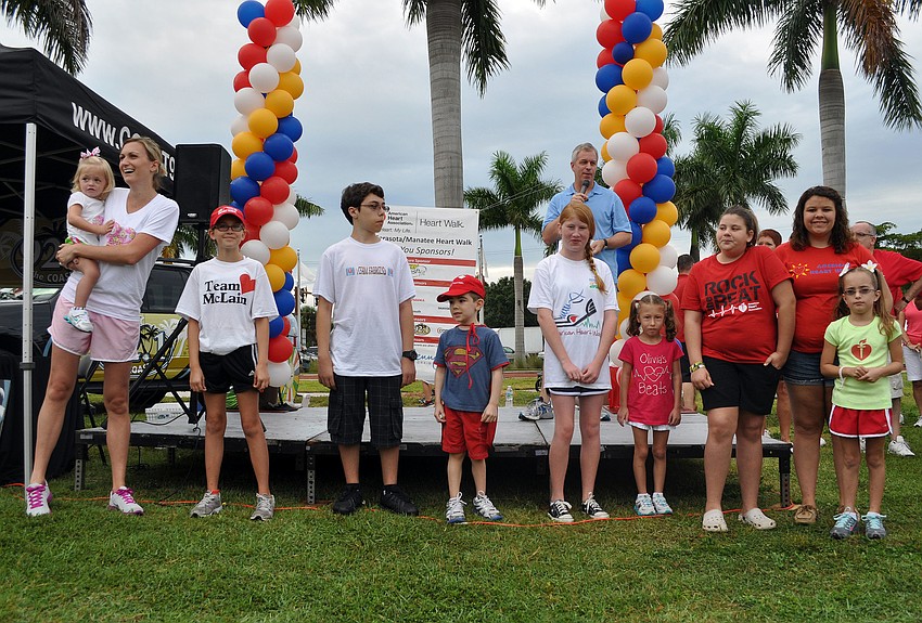 Some of the young heart disease survivors stand in front of the stage to be recognized Saturday, Sept. 22 at Payne Park.