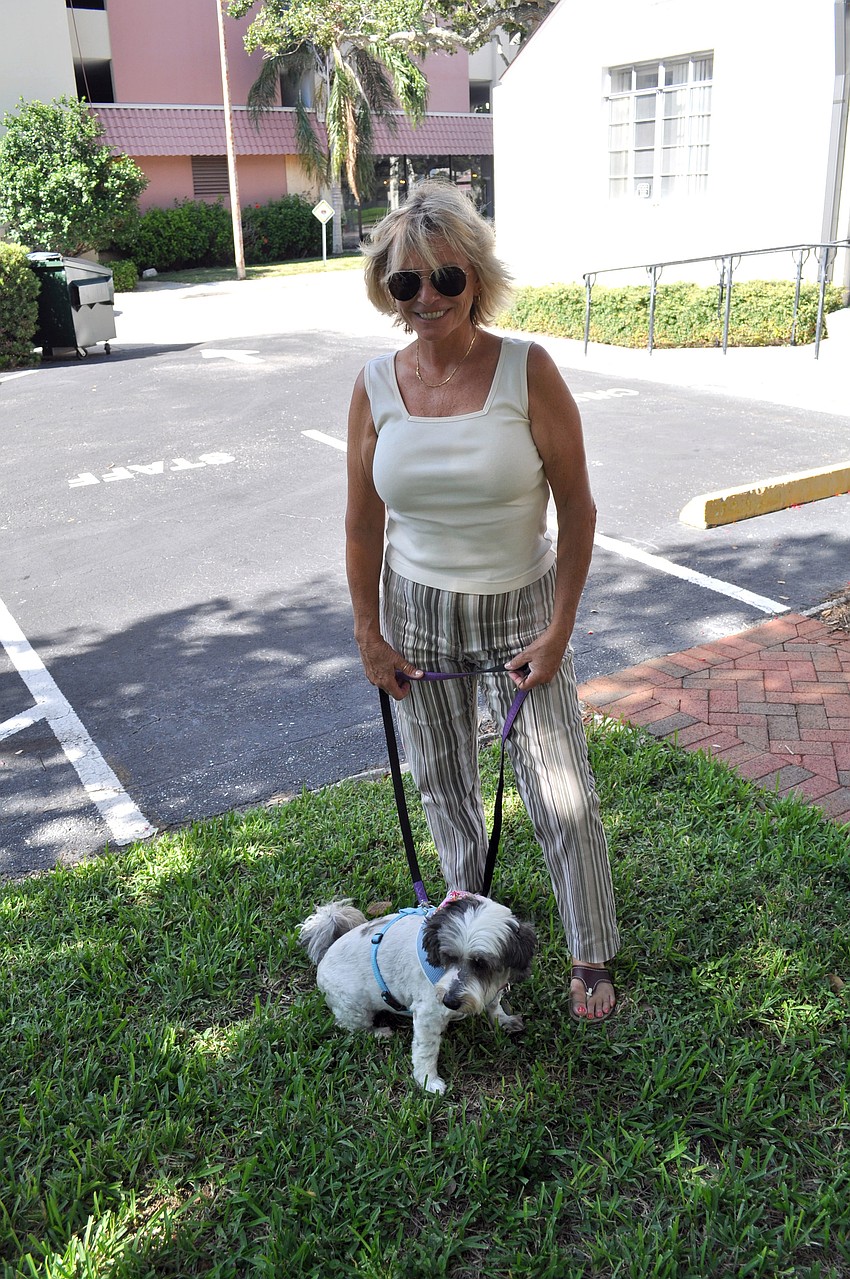 Linda Lee Miska with her dog, Yuqita con Mojo, a Havanese, who was trained in Spanish. Her name translates to â€œlittle sweet potato with sauce.â€