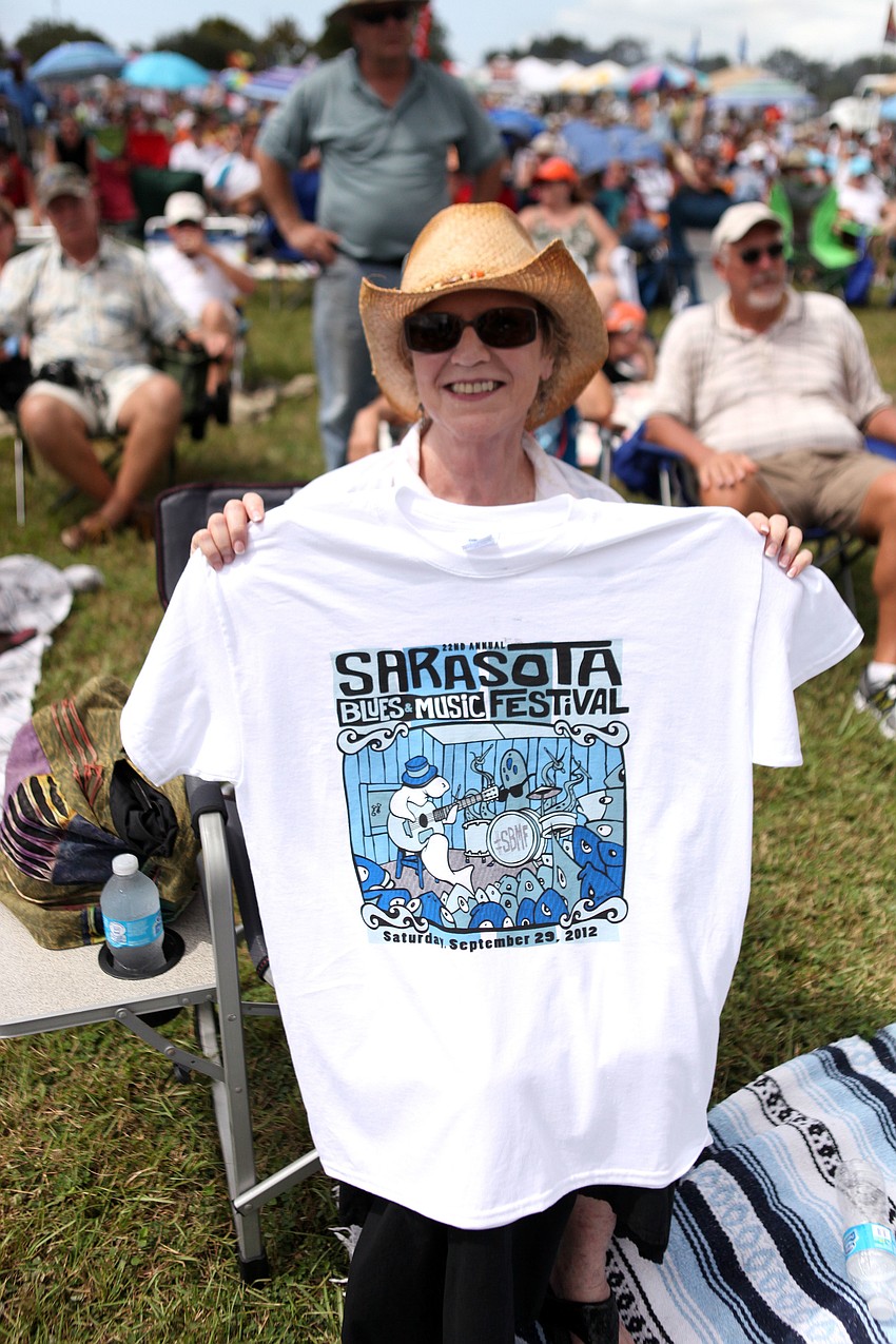 Peggy Tanney shows off her 22nd annual Sarasota Blues Festival t-shirt.