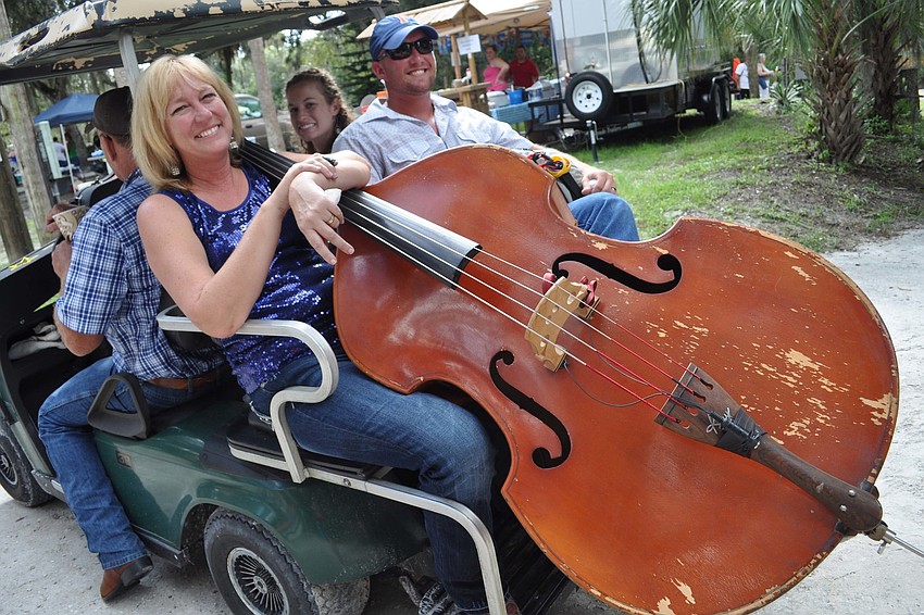 April Rogers and Ryan Clark got ready to perform with their band, Generations Bluegrass Band.