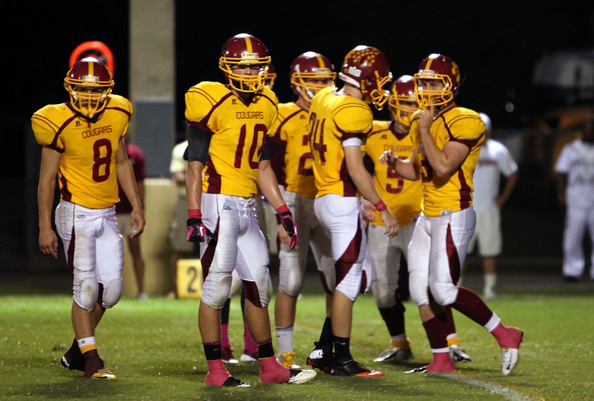 The Cardinal Mooney football players make their way out onto the field before the start of their homecoming game against St. Petersburg Catholic Friday, Oct. 12.
