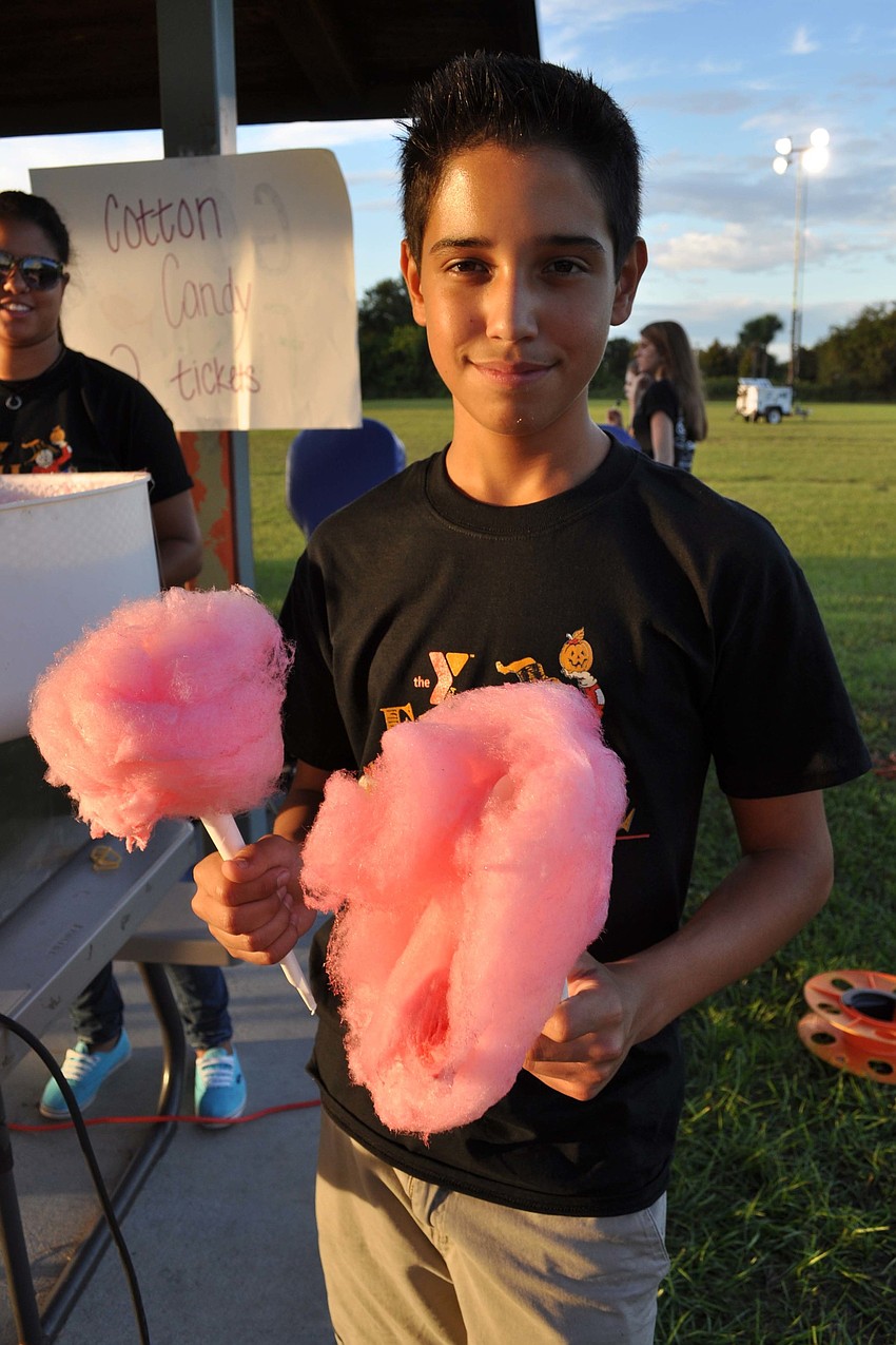 Mark Palomino, of Lakewood Ranch High School, helped sell cotton candy.