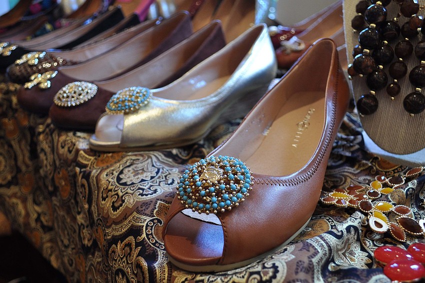 Attendees browsed through a wide selection of unique crafts and products, including shoe designs by Diana E. Kelly.