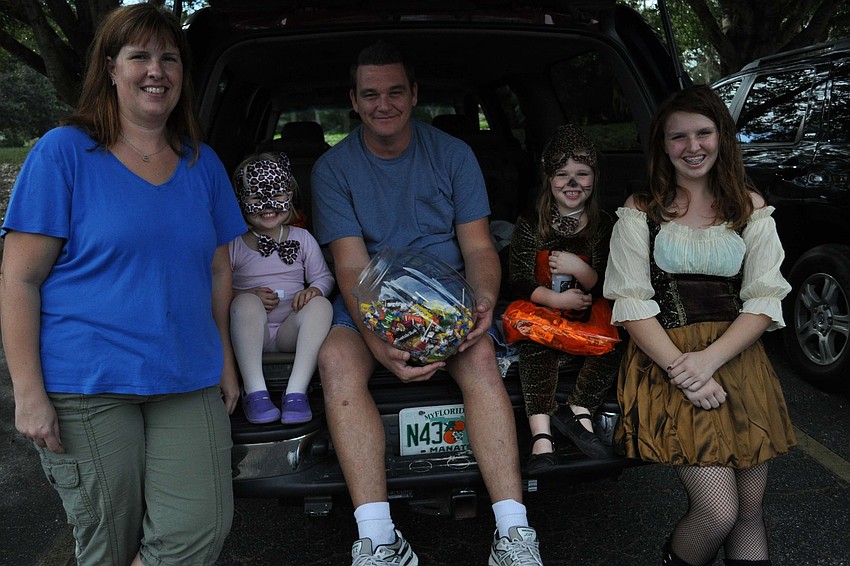 Jennifer Webb passed out with her family â€“ Emma, Jeff, Samantha and Asa.