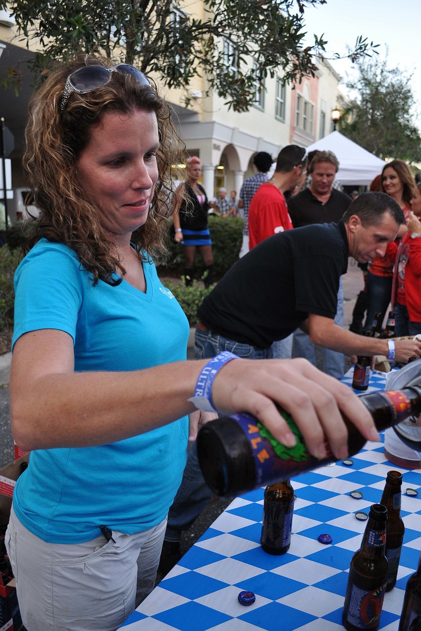 Jessica McGuire, of Woodyâ€™s River Roo, poured samples from Victory Brewery.