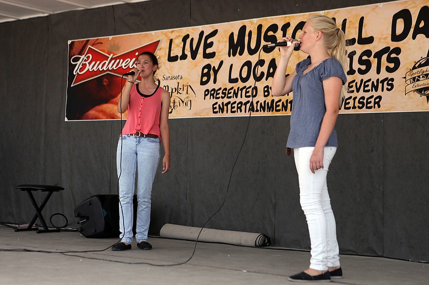 Lilly Okland, 13, and Morgan Krikke, 13, perform â€œFor Goodâ€ from the musical Wicked.