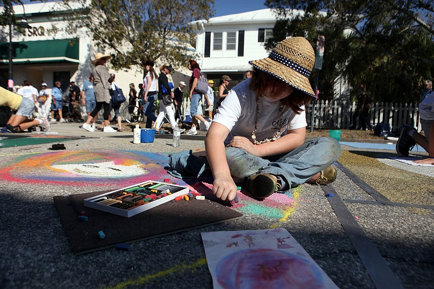 Sara Martin, 9, works on her piece that she called â€œCircus Catâ€.