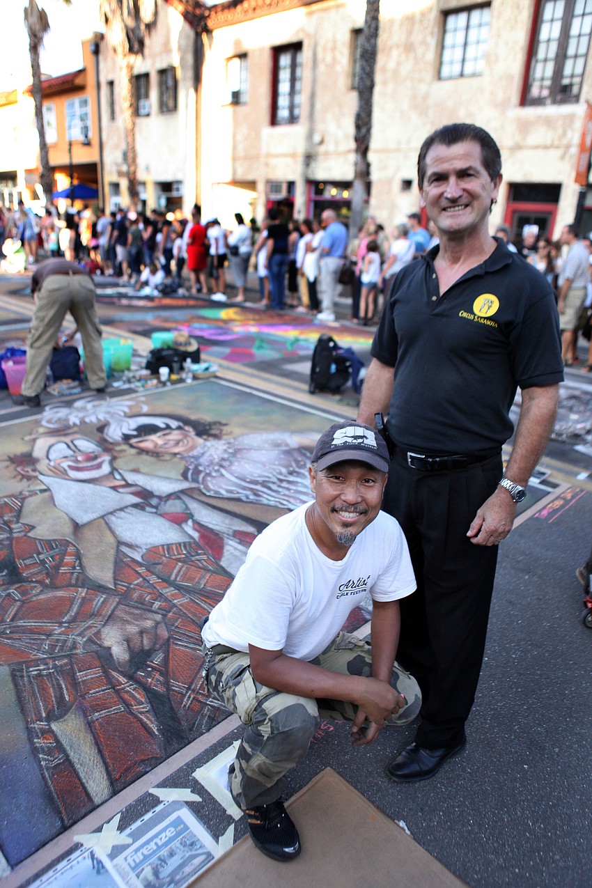 Tomoteru Saito poses with Pedro Reis in front of Saitoâ€™s piece â€œLou Jacobs with his daughterâ€. Lou Jacobsâ€™ daughter is Circus Sarasotaâ€™s Dolly Jacobs, Reisâ€™ wife.