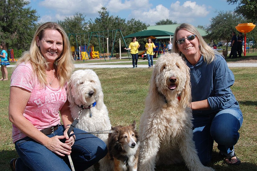 Stacey Shepherd and Amy Kester bring their Golden Doodles and Sheltie to be a part of the doggy fun.