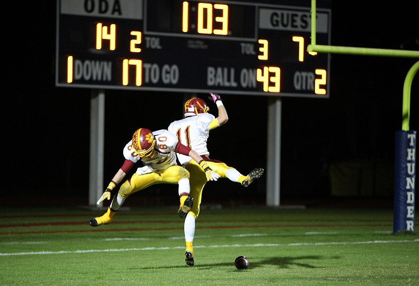 Nick Levanduski, No. 80, and Casey Gunderson, No. 11, celebrate Gundersonâ€™s touchdown.