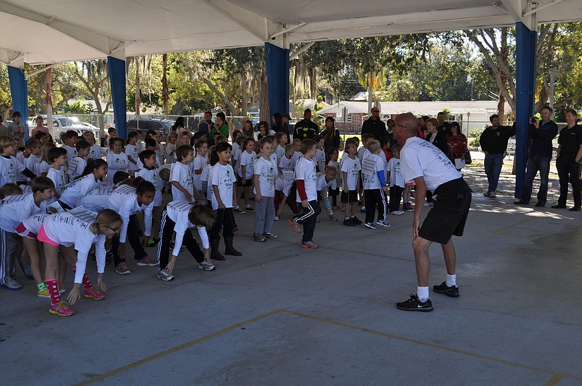 Students stretch before jogging.
