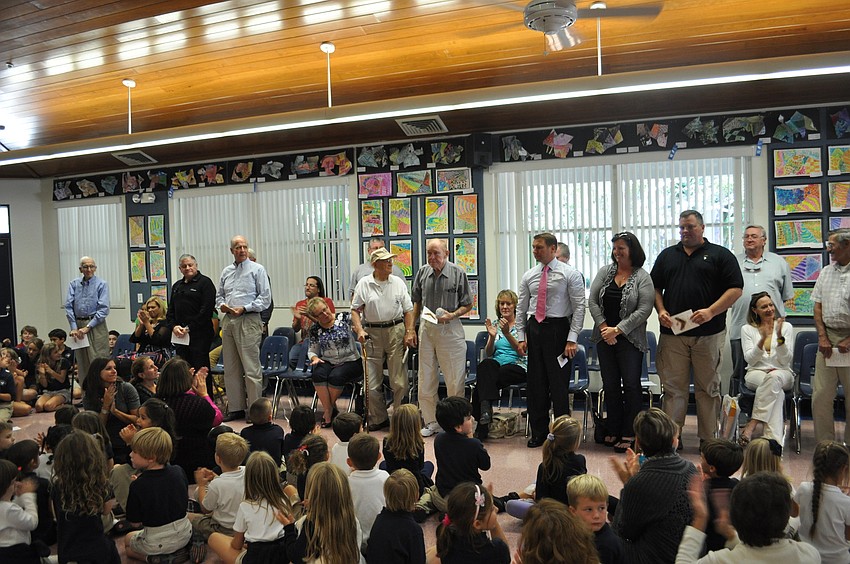 Veterans stand as their names are called.