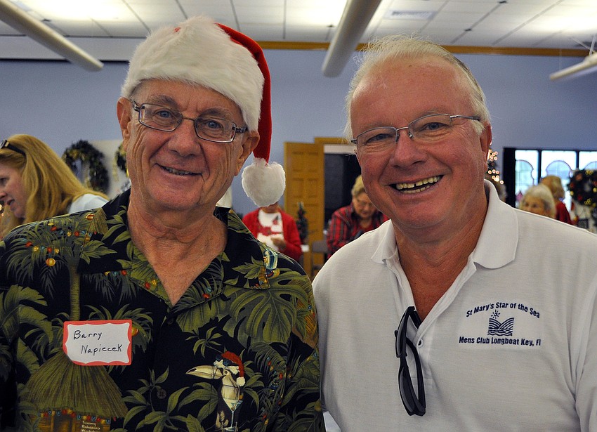Barry Napiecek and David Carter worked the Mens Club raffle table Saturday, Nov. 17, at St. Mary Star of the Seaâ€™s Holiday Bazaar.