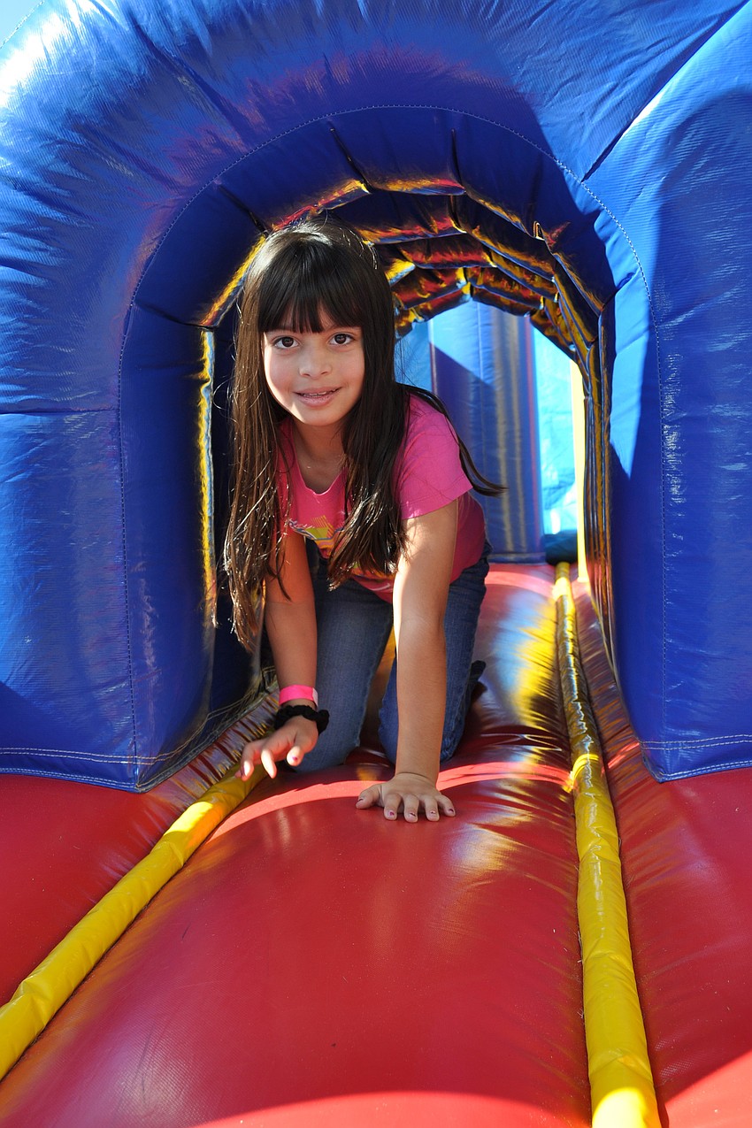 Alexcia Rodriguez, 8, enjoyed going down the inflatable slide.
