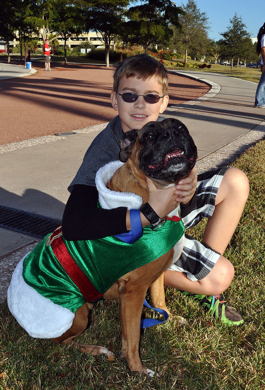 Ryan Mandia, 11, with his dog, Bandit.