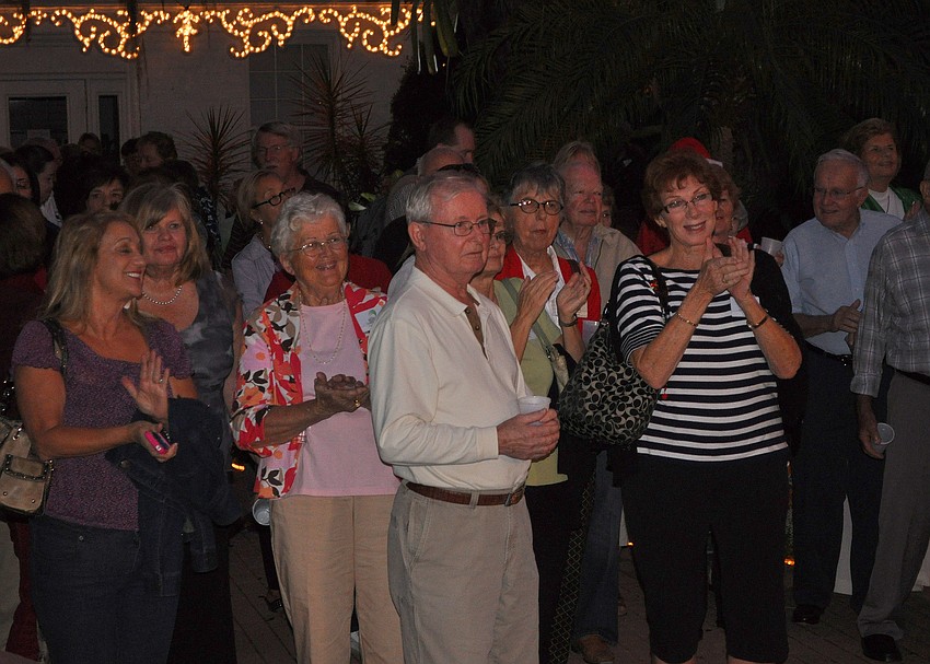 The crowd claps after Booker High Schoolâ€™s choir performed.