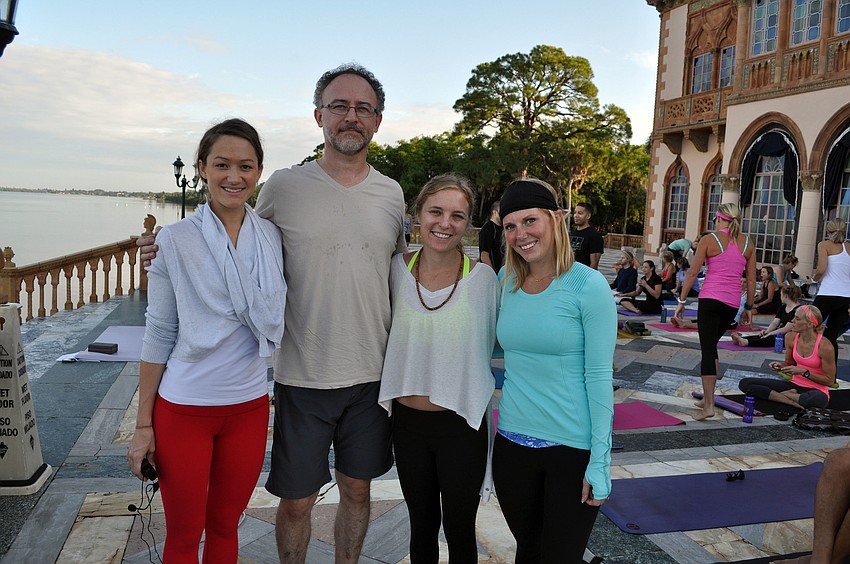 Courtenay Hitchon, Randall Buskirk, Britt Dienes and Stacy Gonzalez pose together before the start of the first monthly Yoga at the Ringling yoga class Saturday, Sept. 15 at the Ca dâ€™Zan.