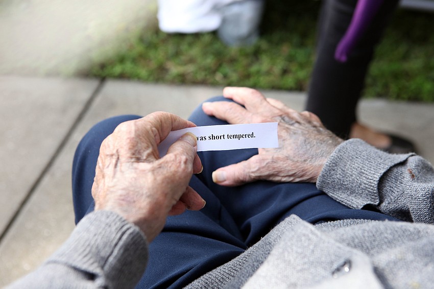 Ted Bleecker holds a piece of paper reading â€œI was short temperedâ€, one of the sins people could chose to fess up to and have washed away during the Tashlich ceremony.