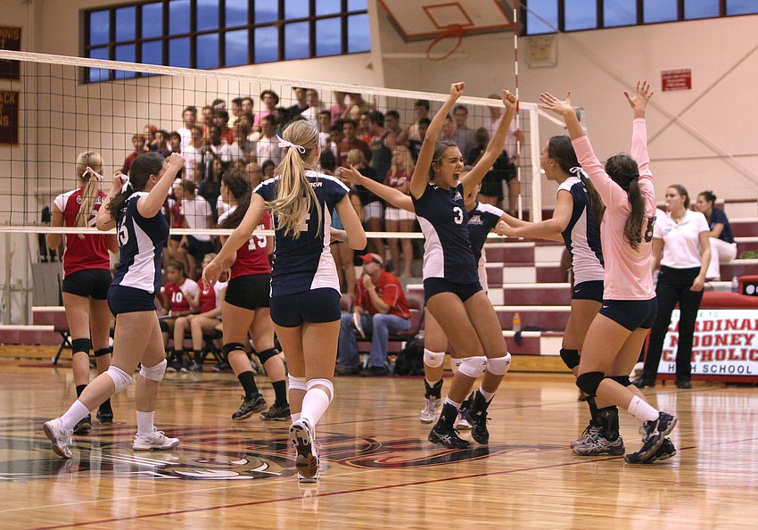 The Out-of-Door Academy celebrates after scoring an important point during their game against Cardinal Mooney.