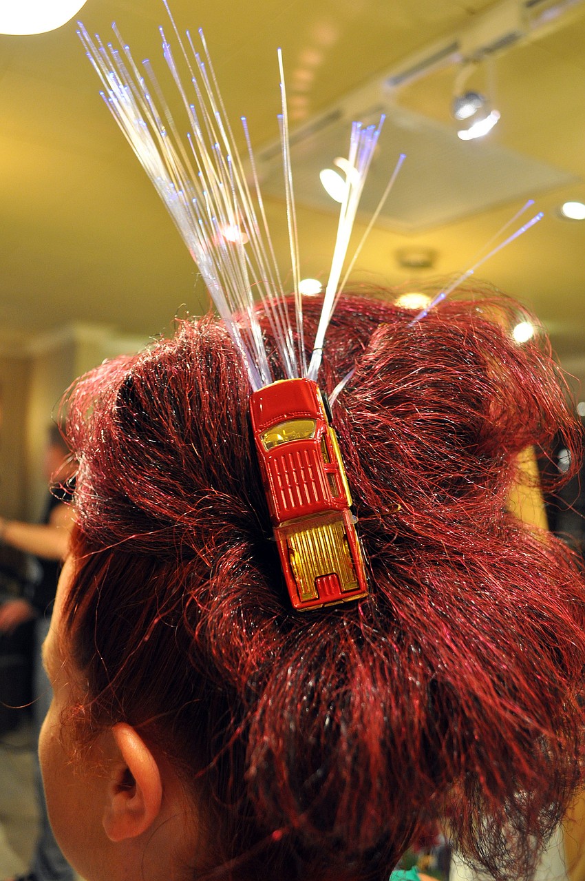 Sophie Isherwood had electric lights and a toy car in her hair for the Electrify the Circle Pre Party Saturday, Sept. 22 at The Met on St. Armands.