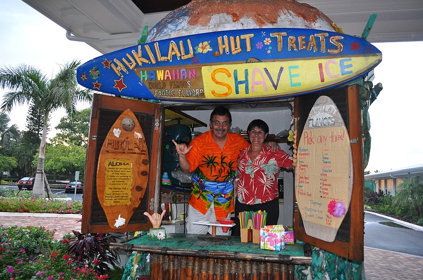 Juan and Renee Gutierrez pose inside the Hukilau outside of Bird Key Yacht Club Saturday, Sept. 22.