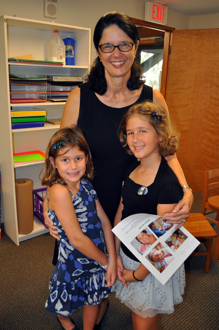 Pastor Kathi Wiggins with her granddaughters Chloe, 7, and Grace, 8, Johnson.