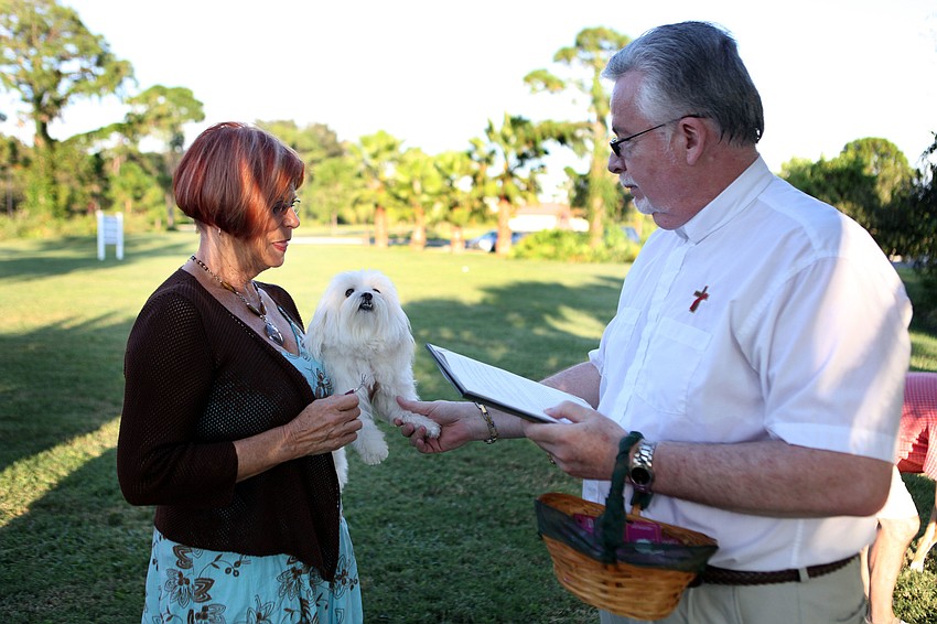 Sharon DePeters with her dog, Romeo, participated in the pet blessing Friday, Sept. 28 at Our Lady of Mount Carmel in Osprey.