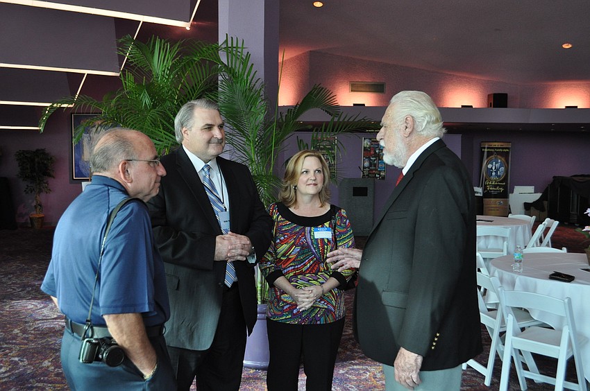 Police chief candidate Mark Teunis greets guests.