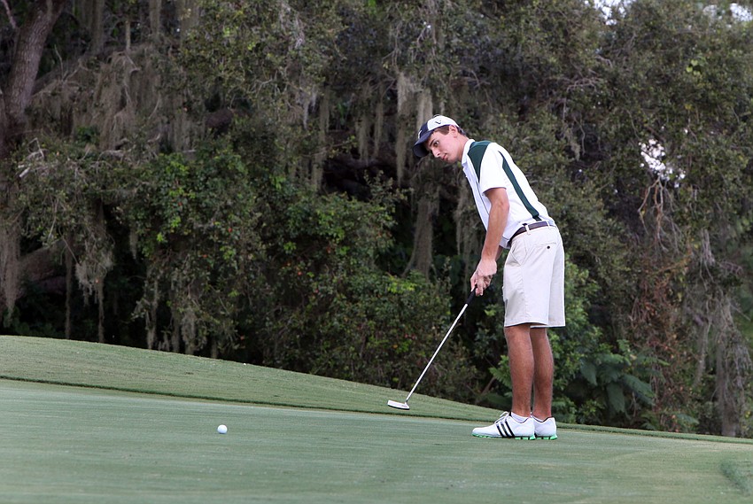 Christopher Pollan, 15, of St. Stephenâ€™s, watches his ball head towards the hole.