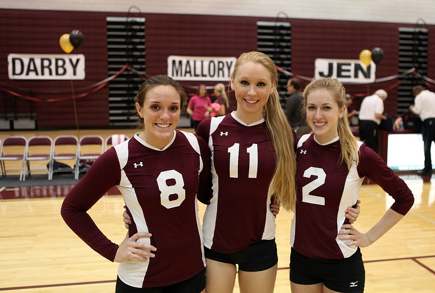 Seniors Darby Tingle, No. 8, Mallory Waggoner, No. 11, and Jen Moor, No. 2, pose together after playing in their final home game during senior night at Riverview High School.