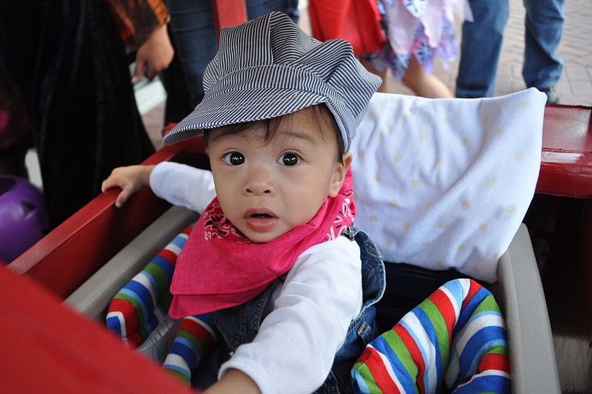 Colin Luangphakdy, 1, rode in the wagon his grandpa made.