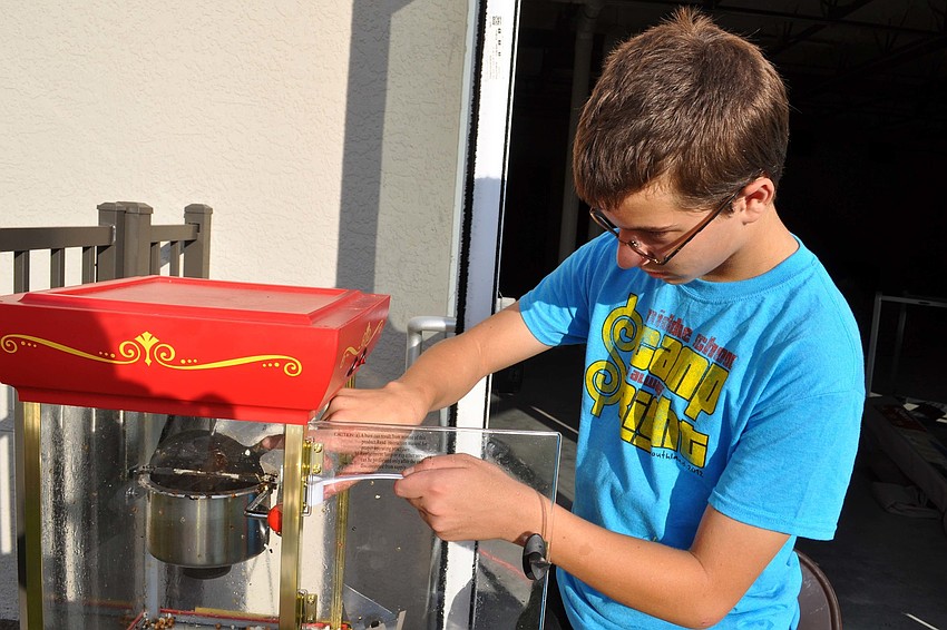 Johnny Diem, 14, made popcorn for guests.
