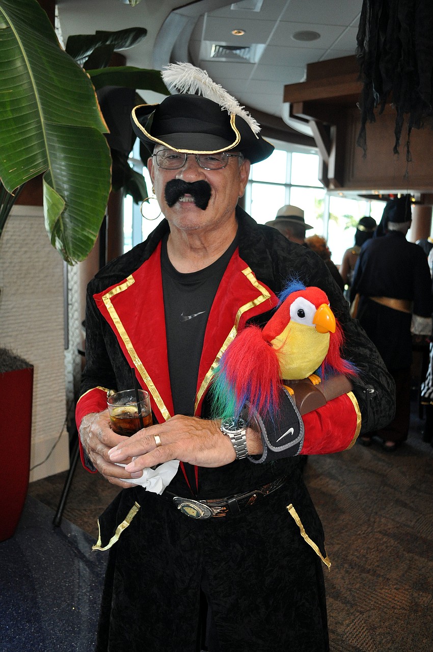 Dick Gravino with his talking parrot, Fred.