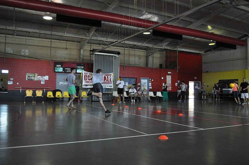 Players throw foam balls as they approach the throw line.
