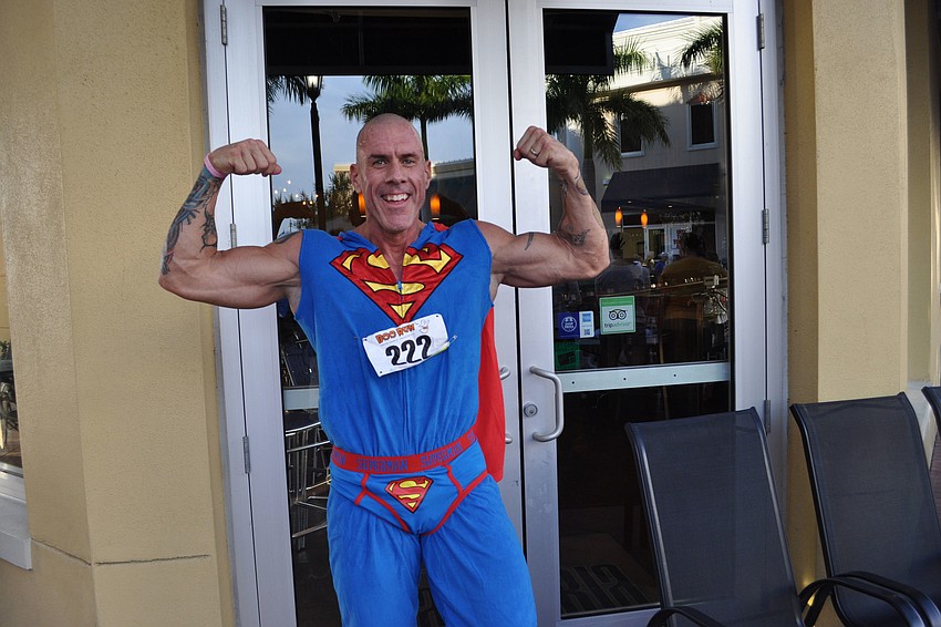 Jeff Morrow showed off his muscles after finishing the race.