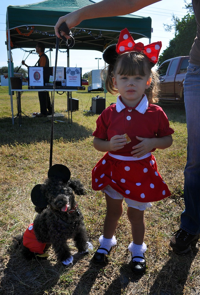 Poe, 9, was dressed up at Mickey Mouse to match Charlotte Machado, 2, who was dressed up as Minnie Mouse Wednesday, October 31, for the Phillippi Farmhouse Market Howl-O-Ween. Poe and Machado won Best Owner/Dog Look Alike.