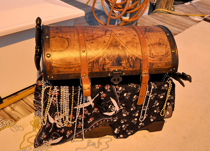 A treasure trunk sits on the docks.