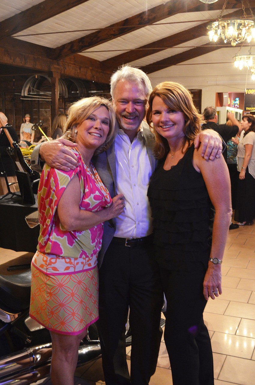 Chairwoman of Cars Under the Starâ€™s kickoff party Leslie Sharp with chair of the SECA Car Show Ralph Cushing and Rileyâ€™s mom Kelly Saba