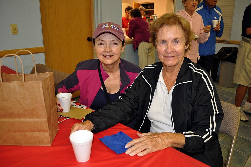 Corinne Ragheb and Esther Wilson enjoy some coffee together.