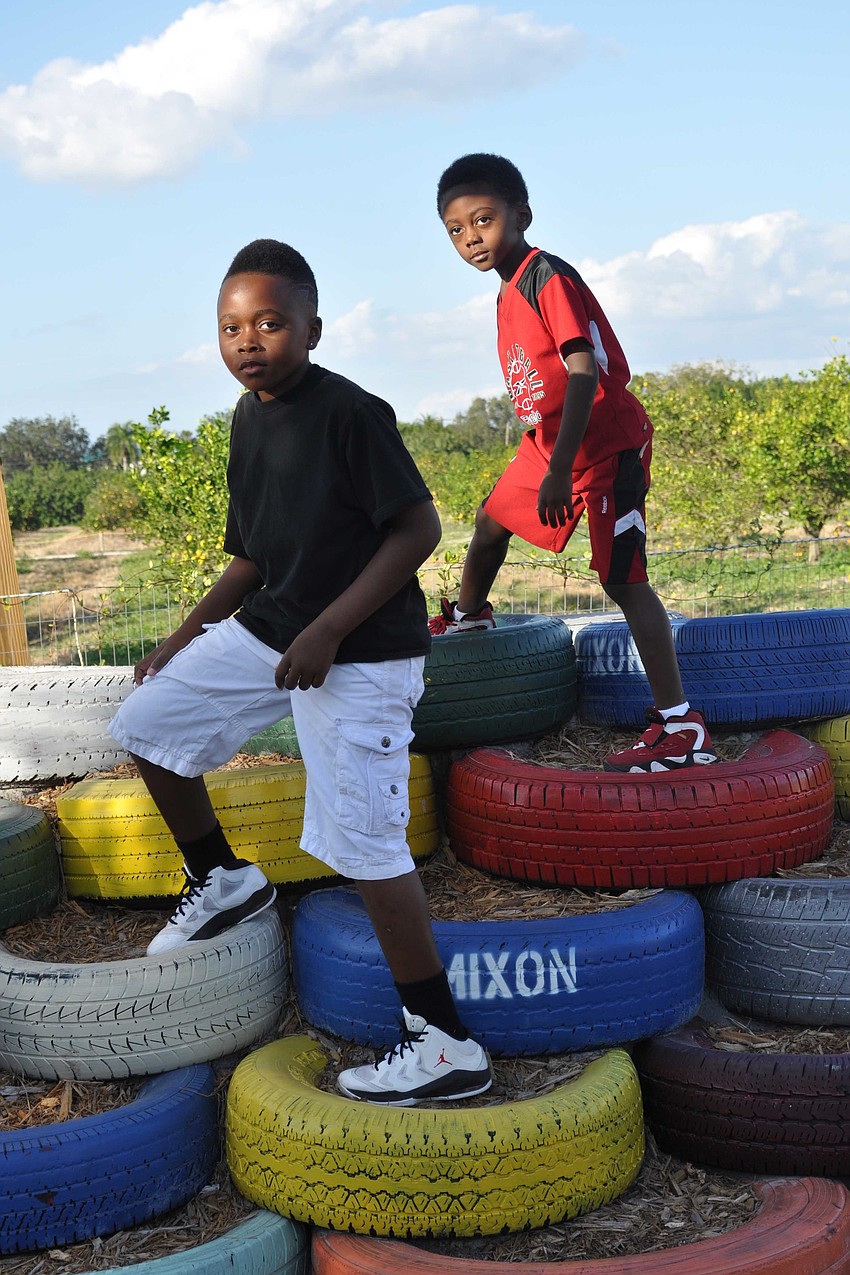 Coron Taylor and Sherrod Lamb stood atop the tires.