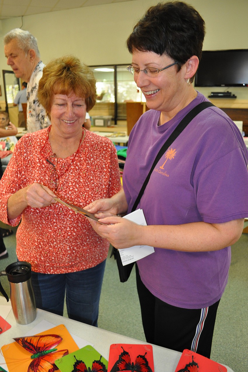 Artist Raye Mongrain showed her butterflies to Jill Chandler.