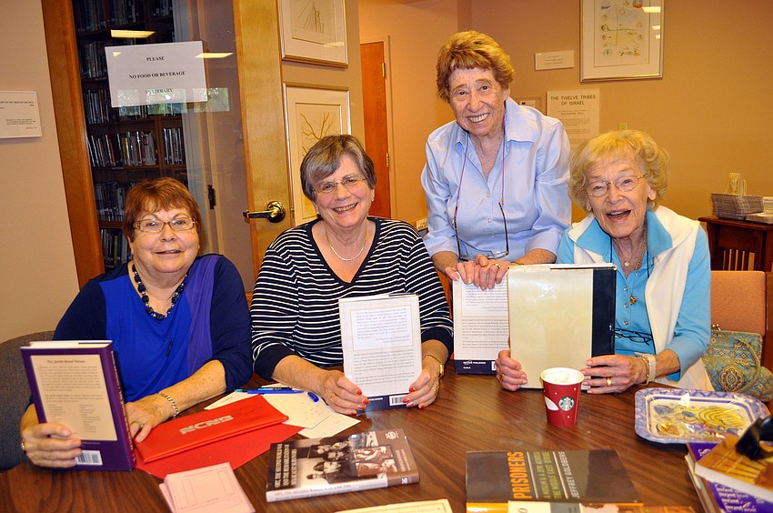 Marjorie Sandy, Gloria Bakal, Gloria Sabin and Gabrielle Miller sold donated books at the Holiday Open House.