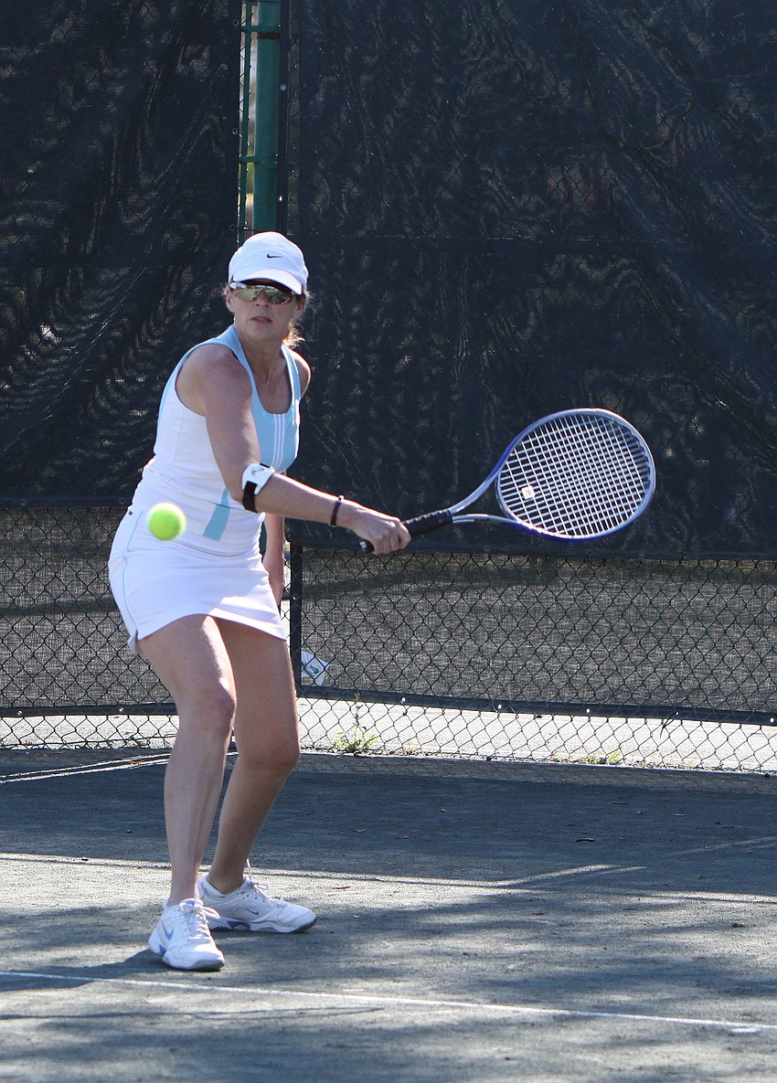 Helene Letourneau warms up before her mixed doubles match.