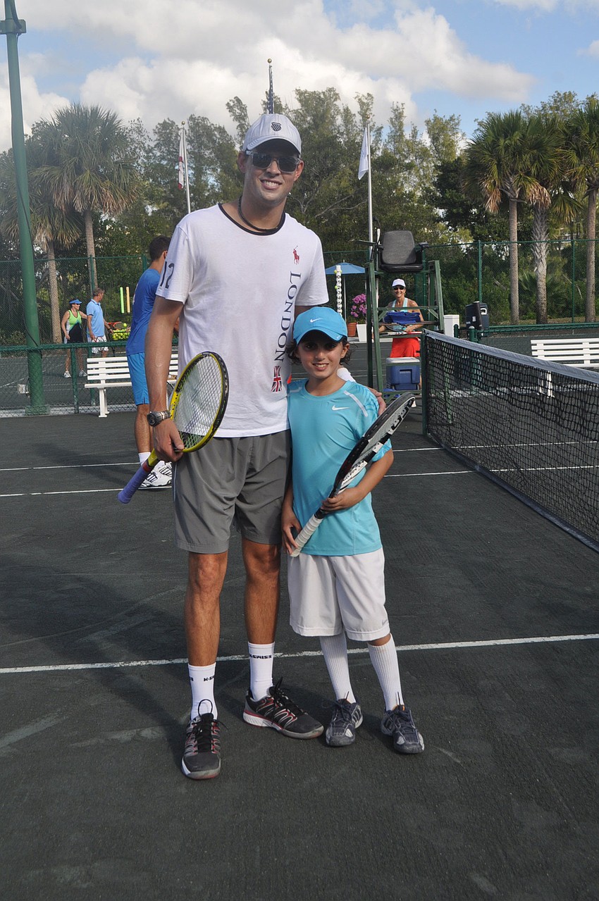 Bob Bryan with Kian Vakili, 9, who recently won both the Longboat Key Club and Boys' Florida State competitions for his age division