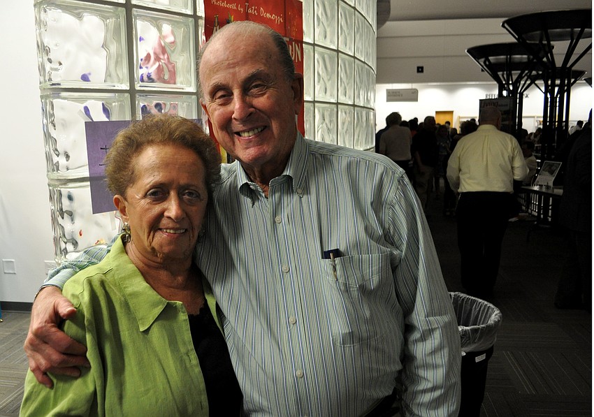 Arlene and Herb Sable wait to use the eventâ€™s photo booth.